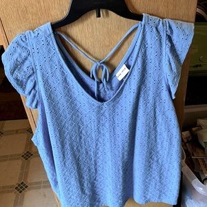 Women’s blouse, tank style with cap sleeves for a little extra coverage.
